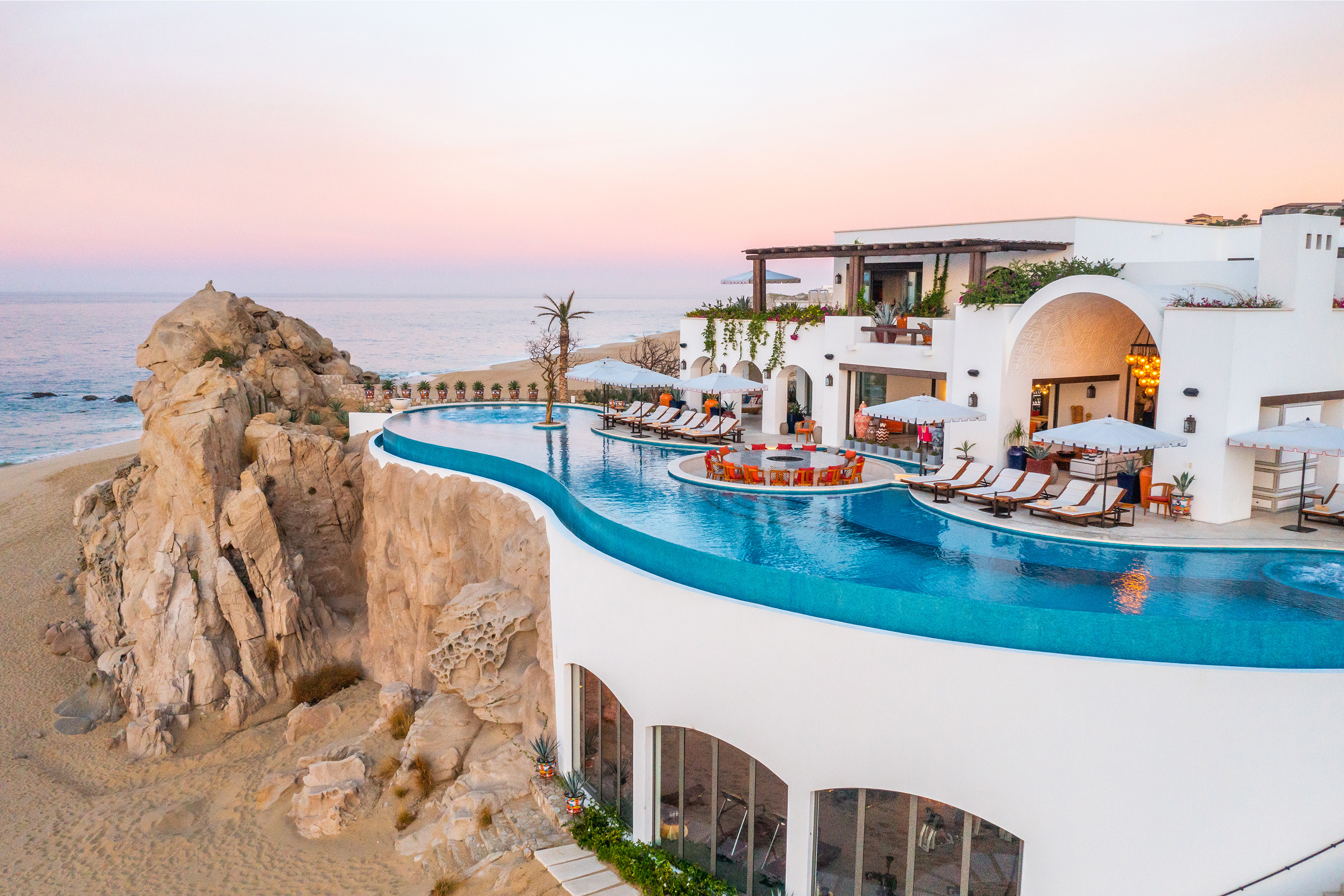 La Datcha private villa in Los Cabos. Huge infinity pool overlooking the beach and rock formations. 