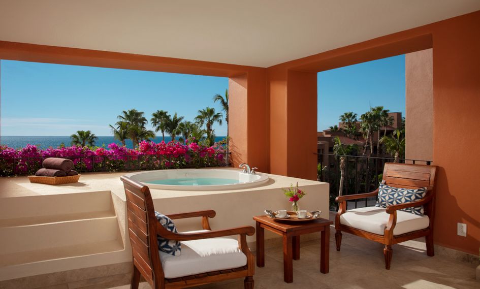 A Zoetry Casa del Mar Los Cabos balcony with a hot tub overlooking the ocean